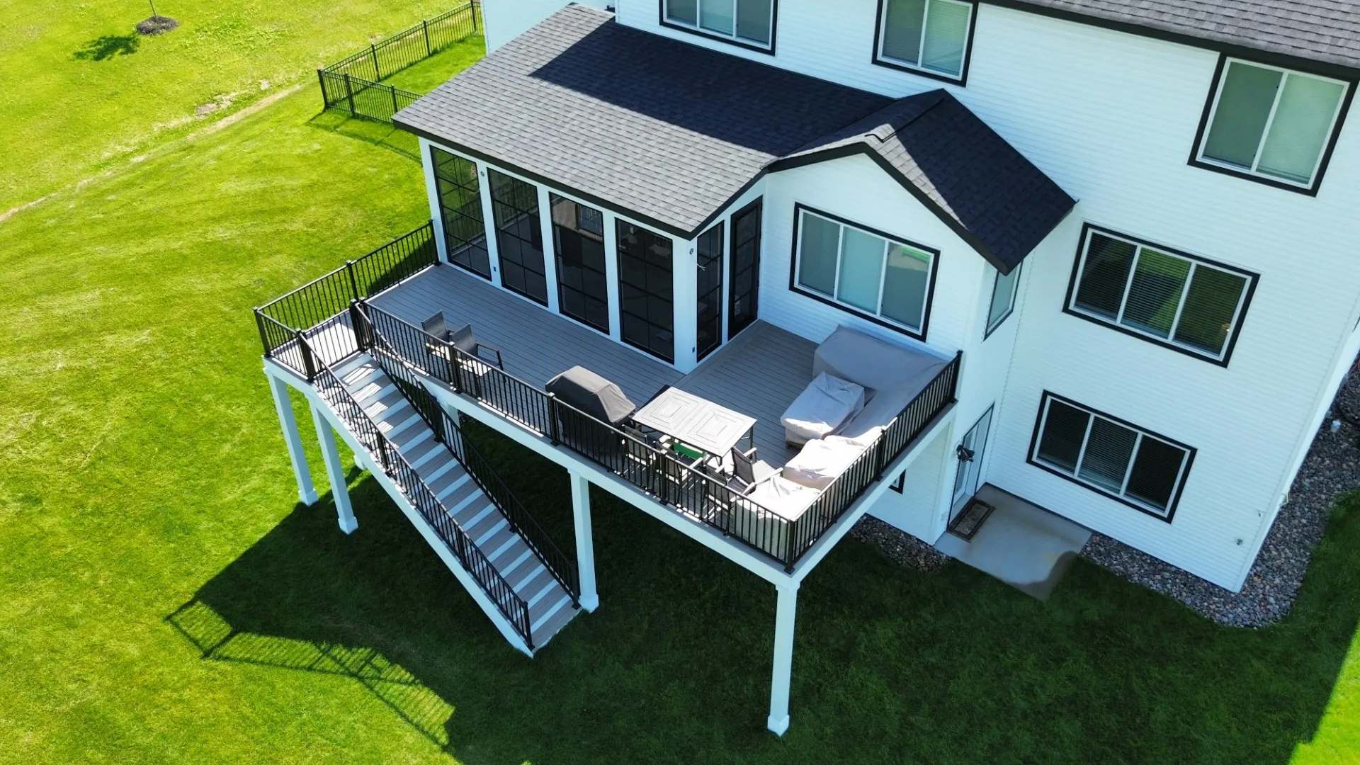 Aeriel view of composite deck with beautiful green land
