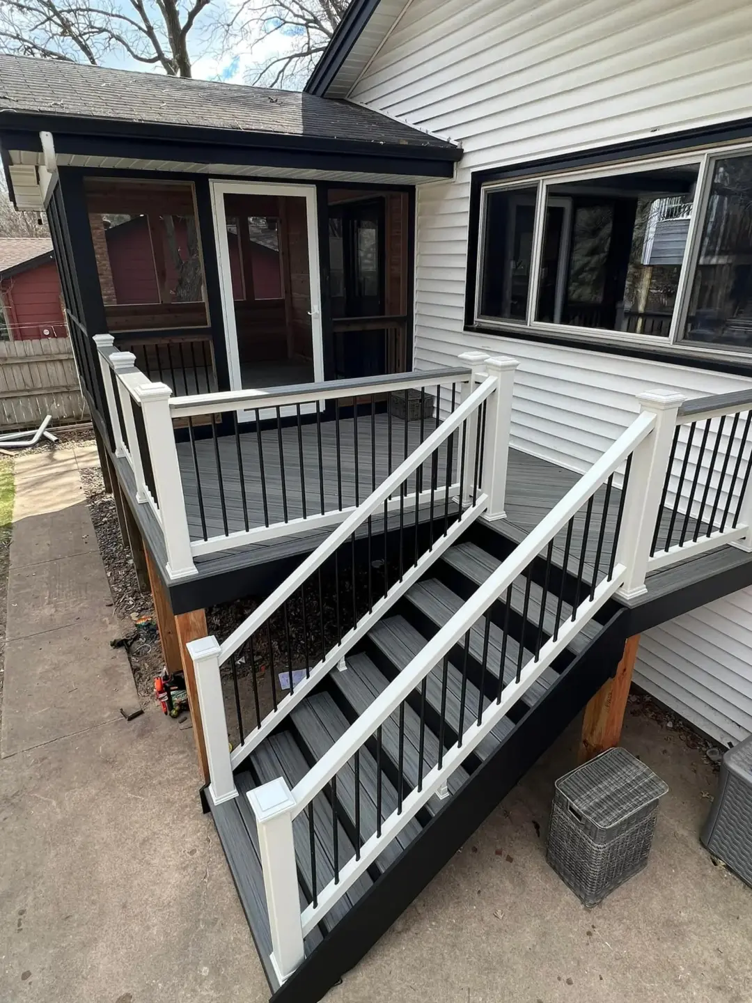 Black stair and deck with covered porch house