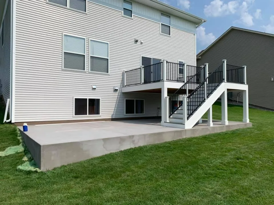 Clean white house with beautiful stairs and deck