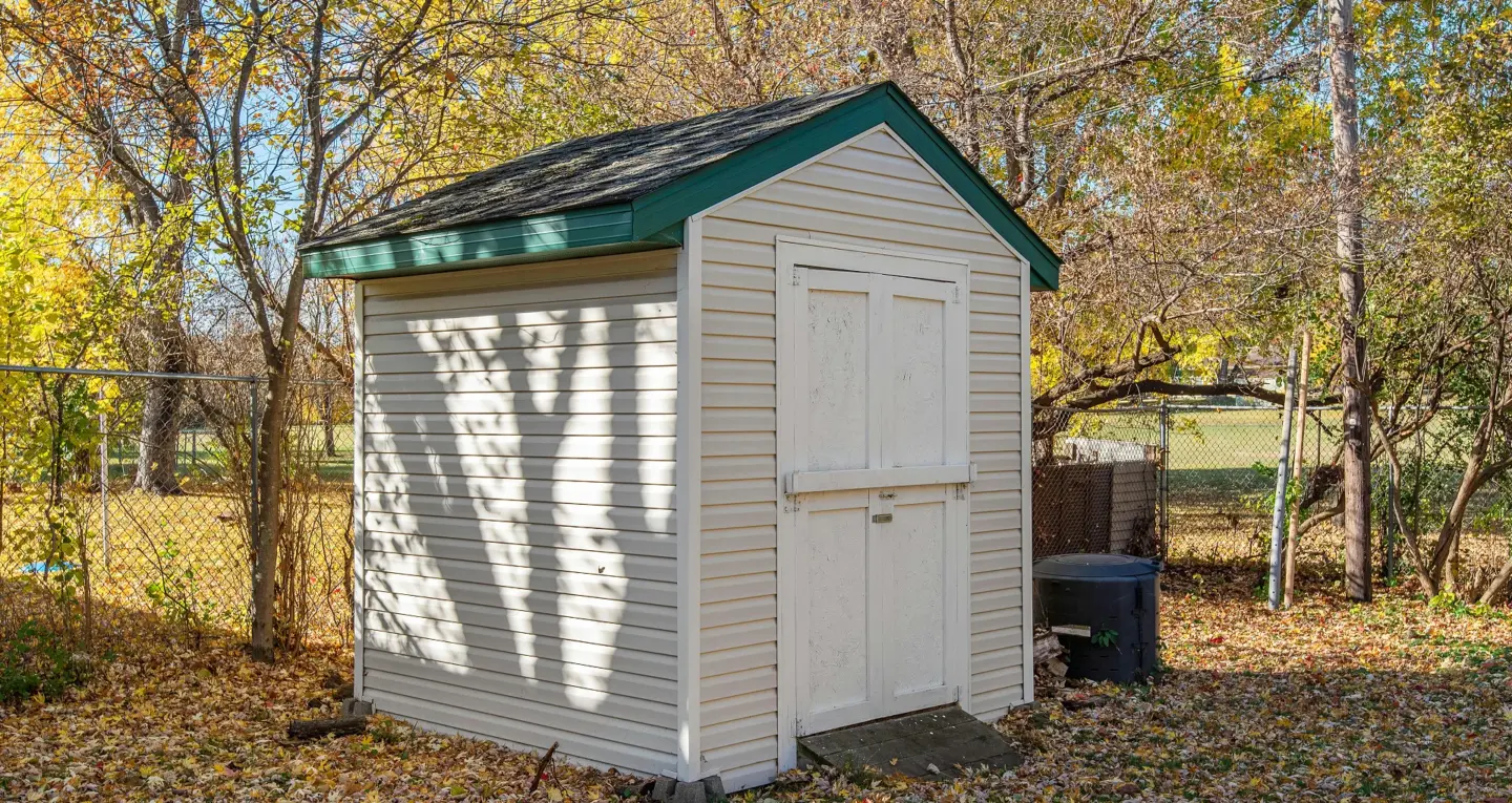 Small white stock shed